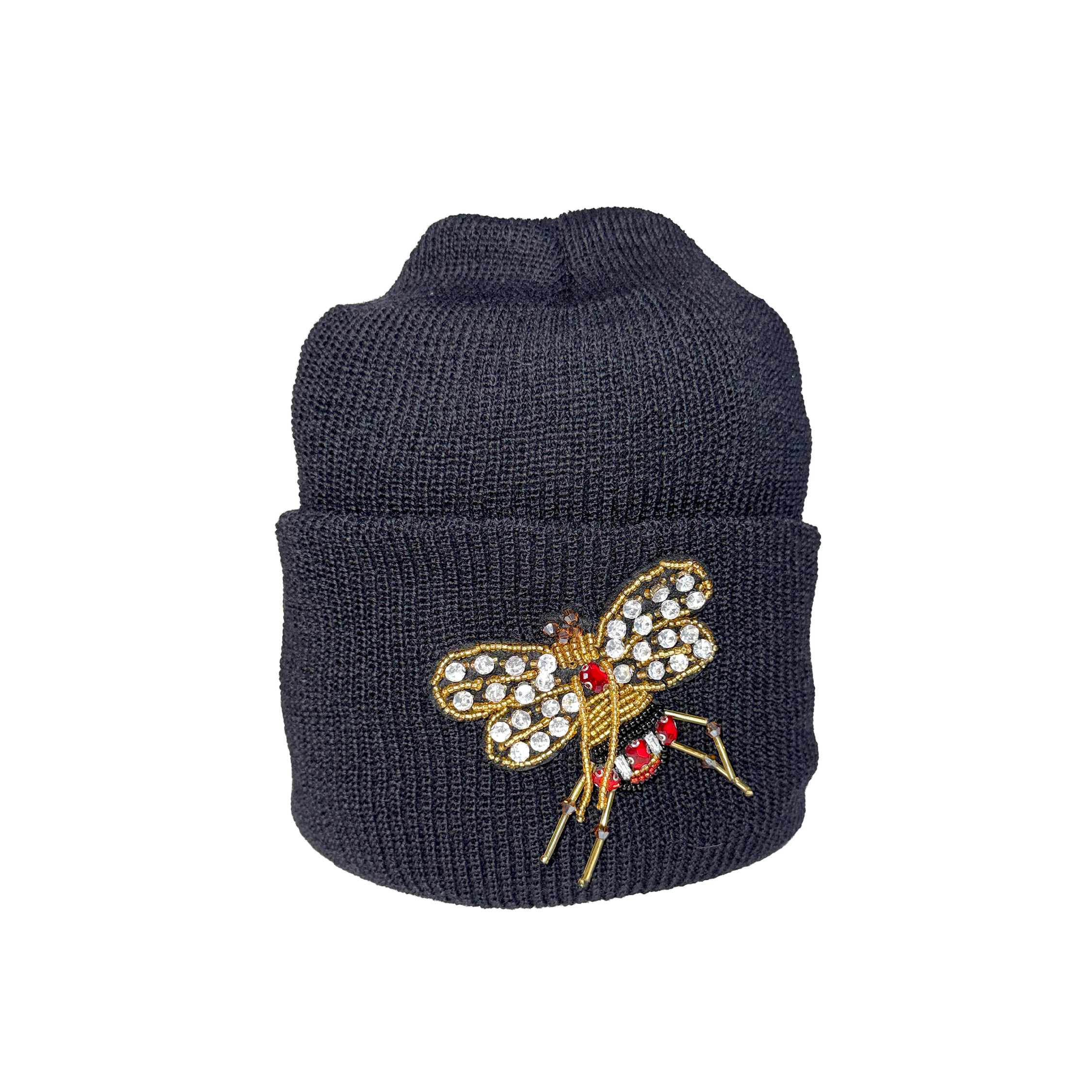 Dark blue knit beanie with a decorative insect embellishment on a white background.