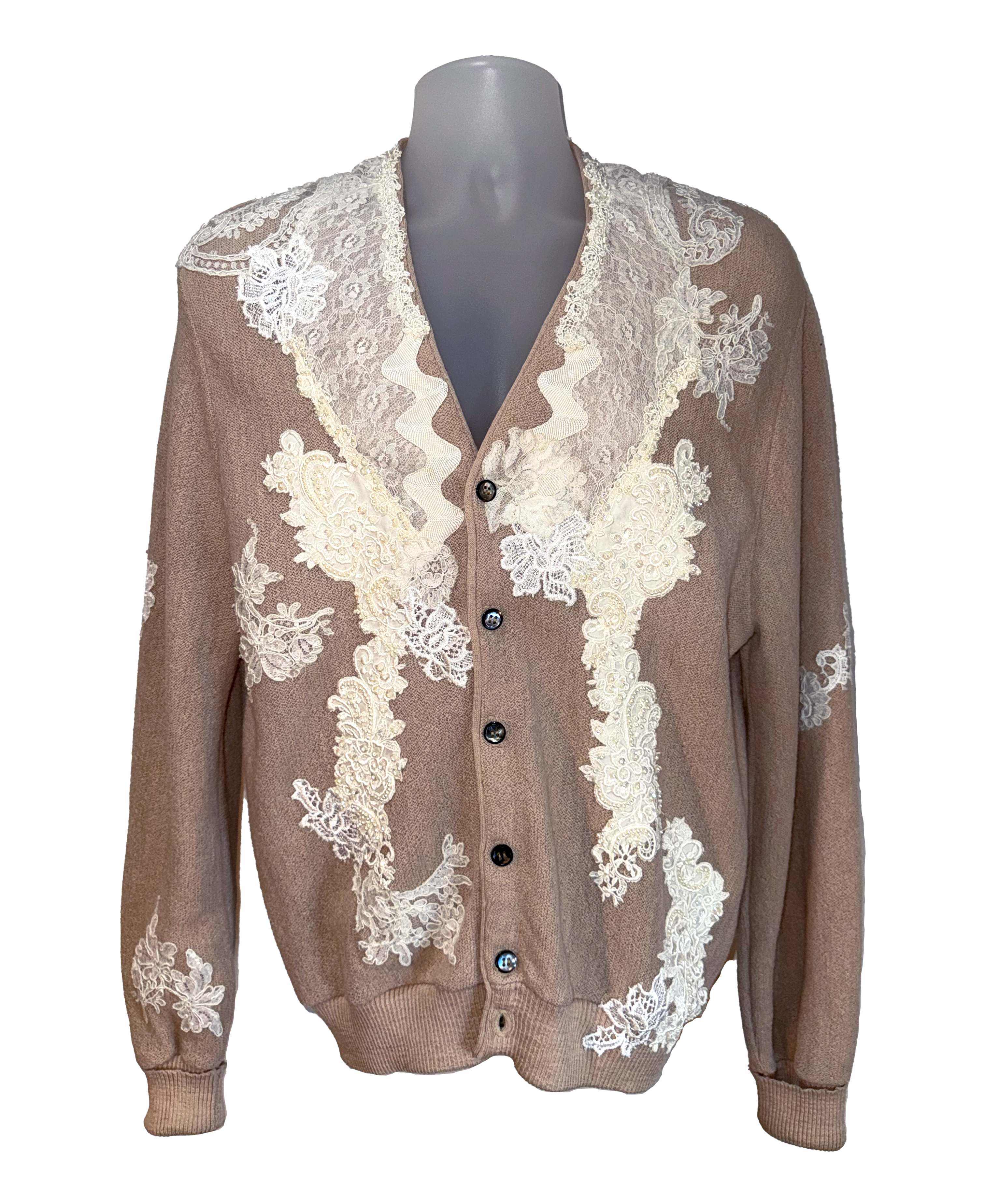 Brown cardigan with white lace detailing on a mannequin against a white background
