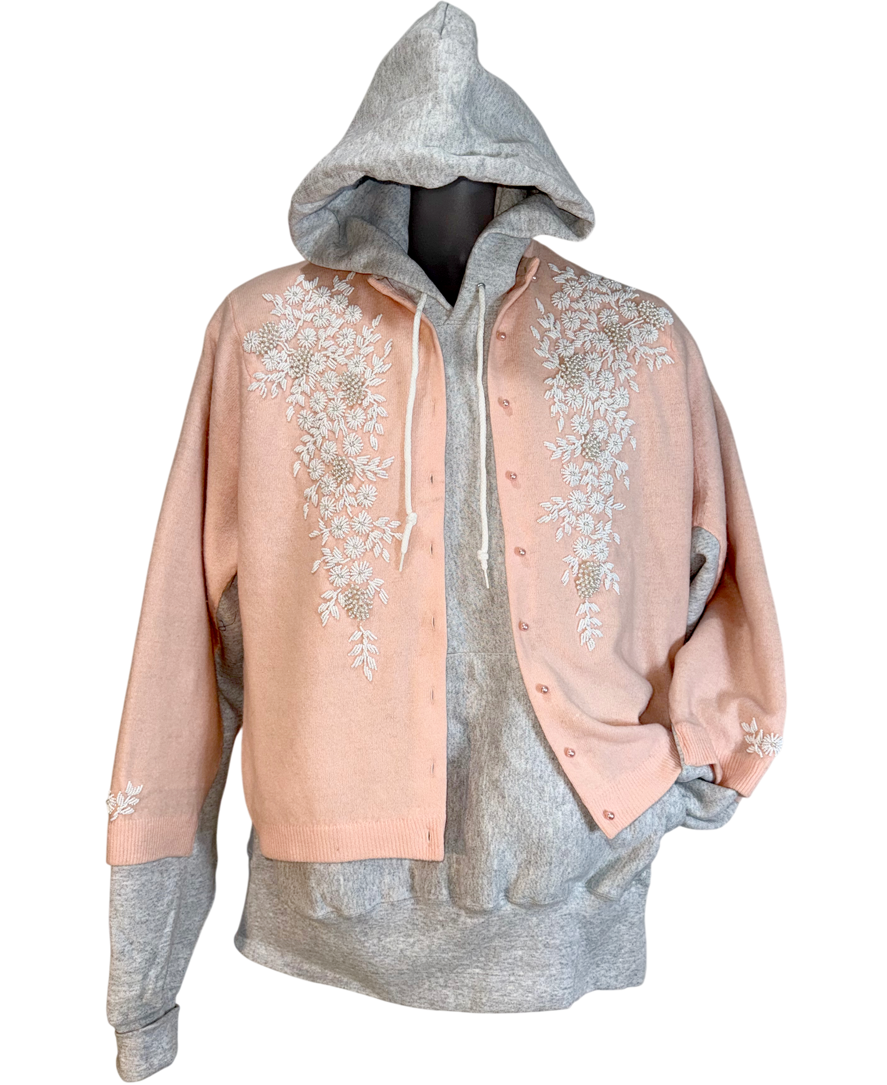 Hoodie with floral embroidery on a white background.