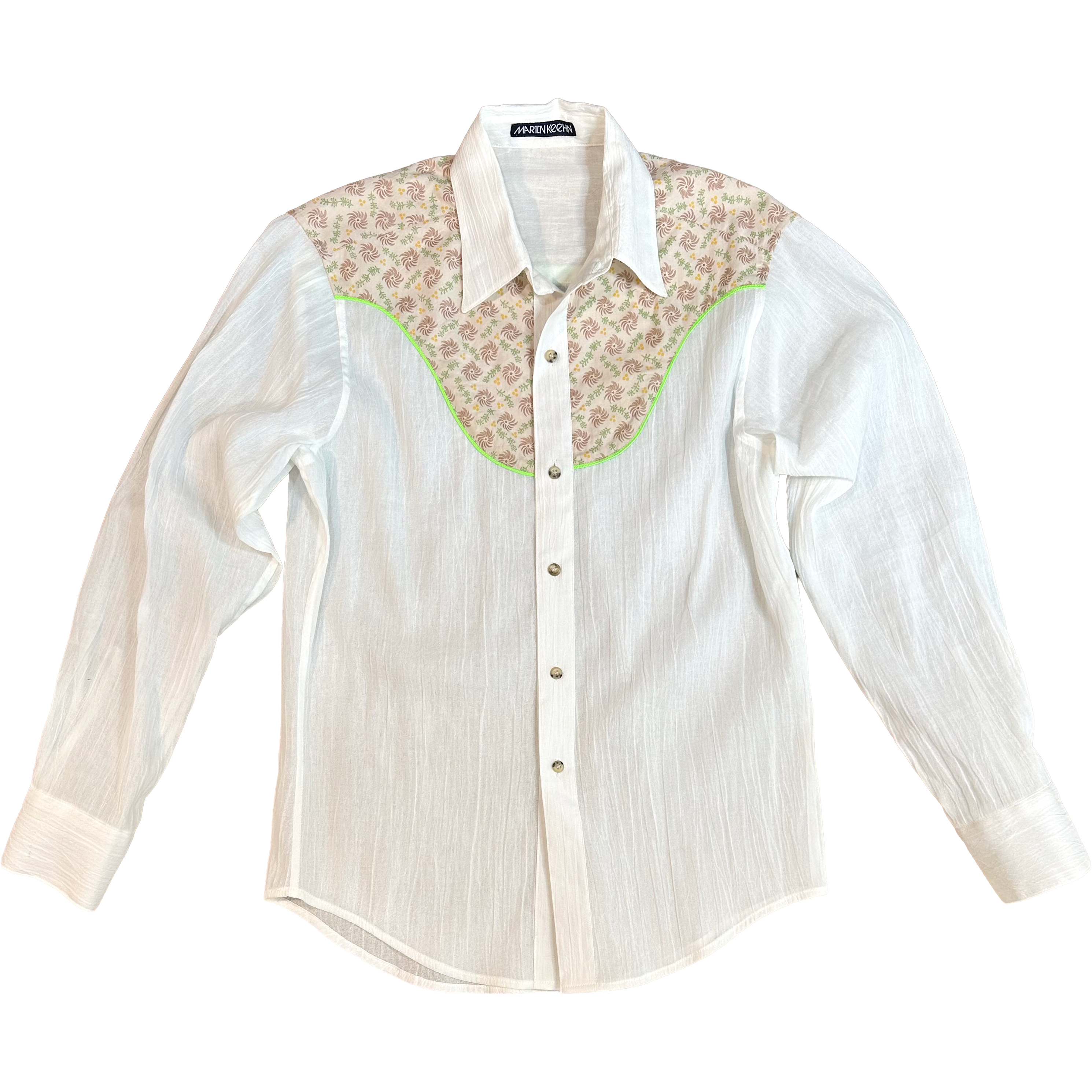 White shirt with floral collar and cuffs on a white background.