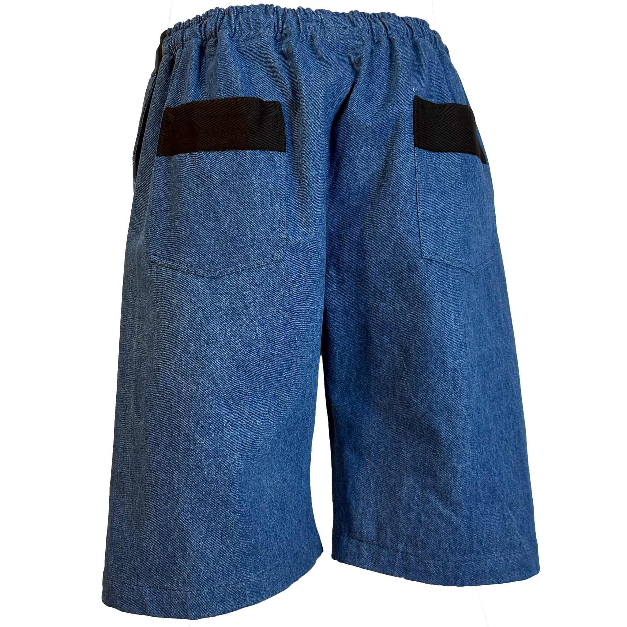 Blue denim shorts with black contrast panels on the back pockets, shown from the rear on a white background.