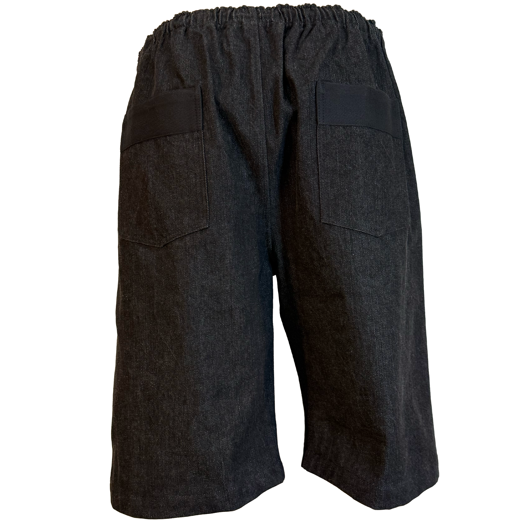 Dark charcoal gray wide-leg shorts with an elastic waistband and two large patch pockets, shown from the back on a white background.