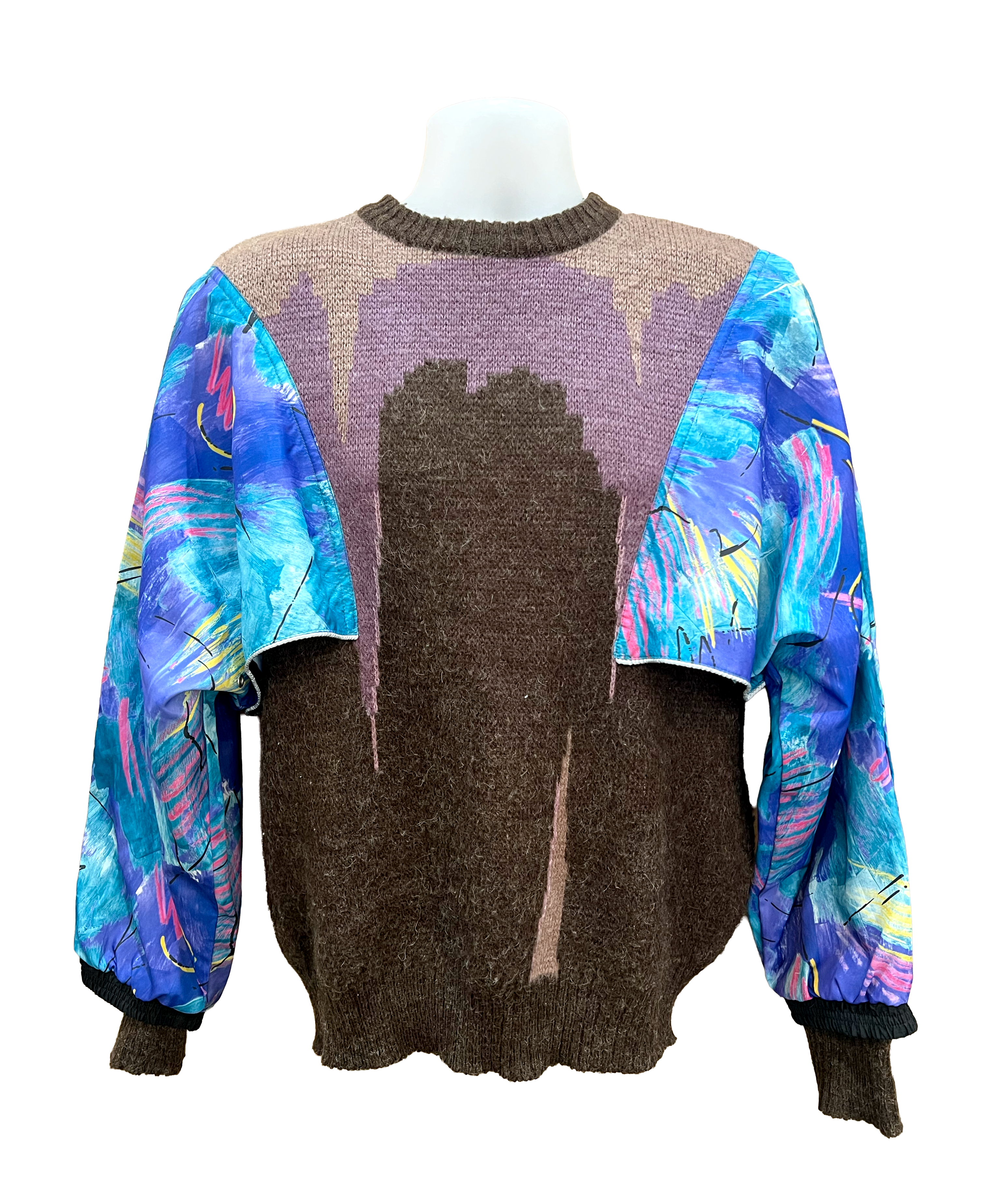 Multicolored sweater with abstract patterns on a mannequin against a white background.