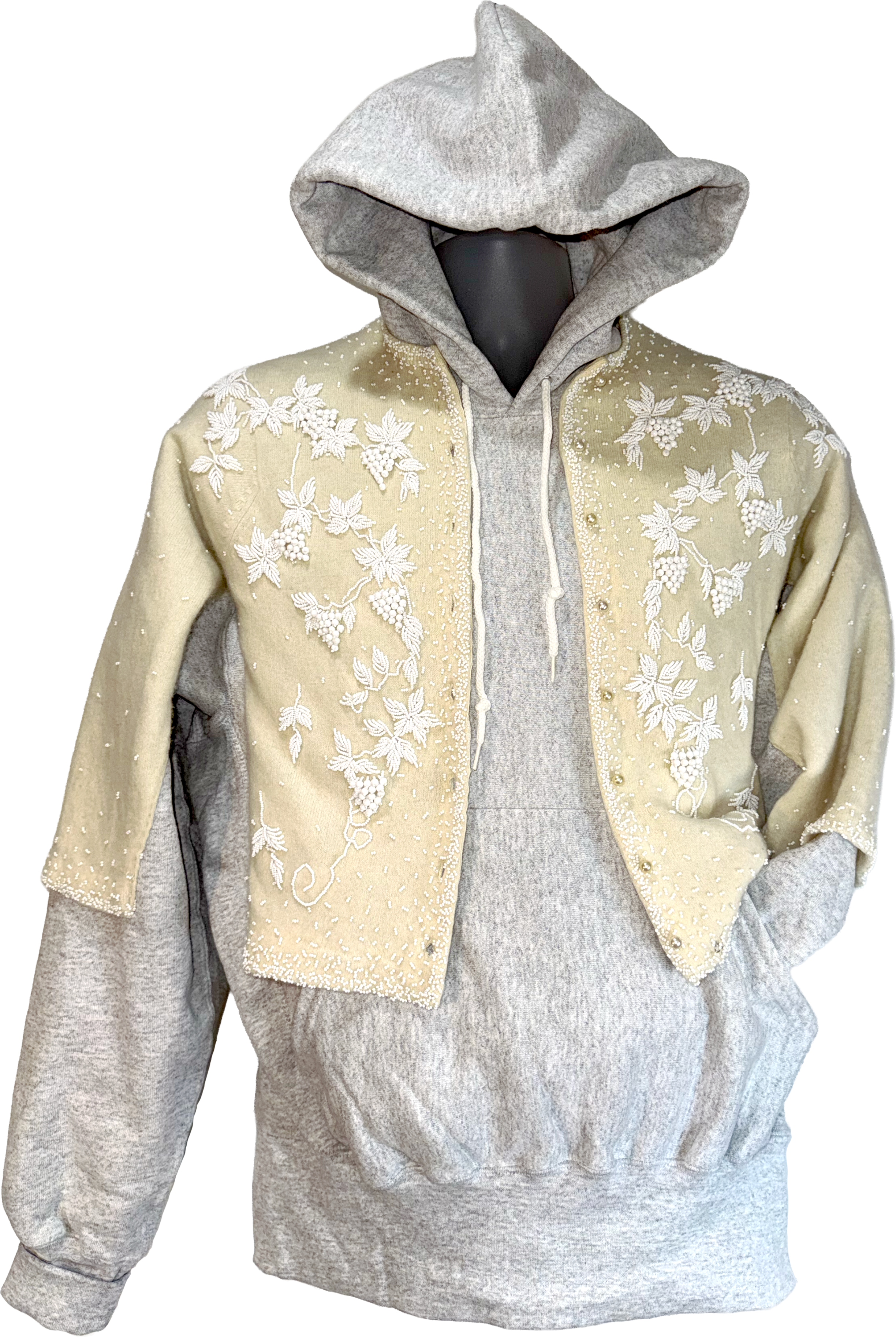 Gray hoodie with beige floral embroidery on a white background.