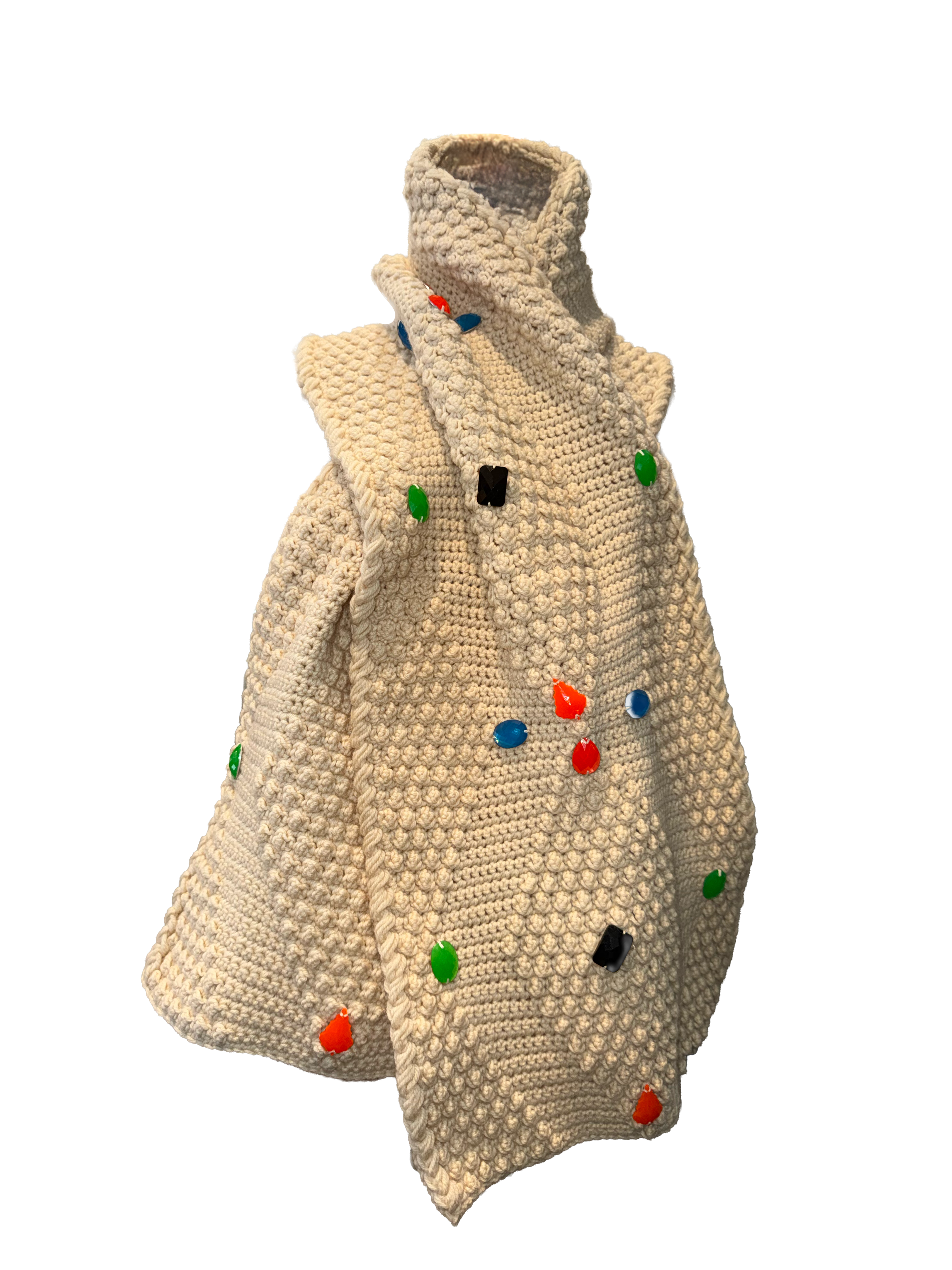 A chunky knit cowl-neck cardigan in cream beige, decorated with colorful pom-pom accents in red, green, blue, black, and white, shown against a plain white background.