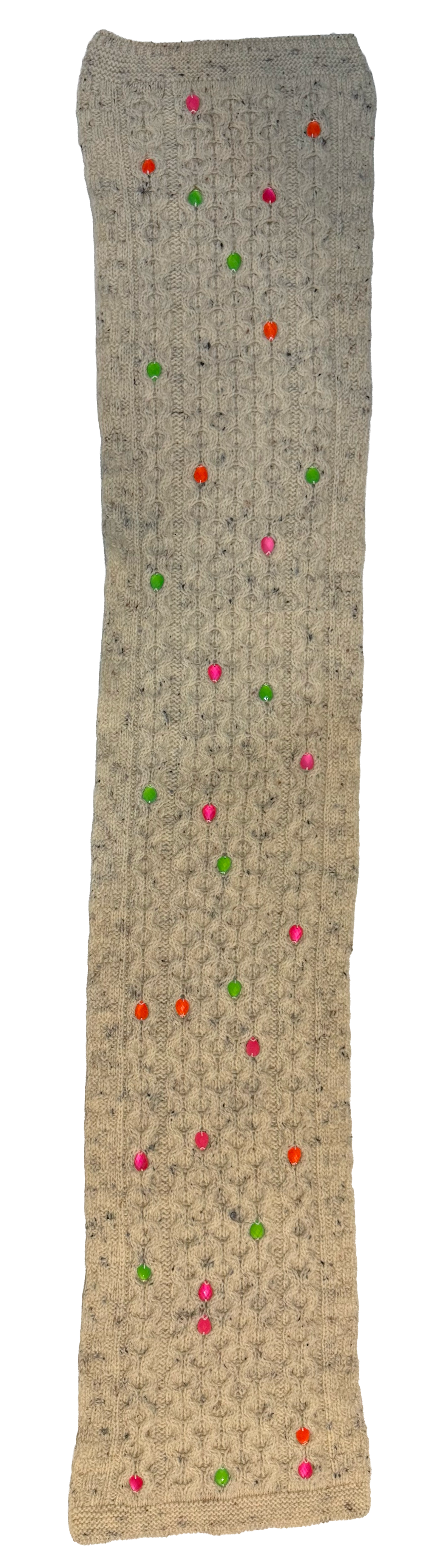 A long, narrow knit scarf or sweater in a textured beige and gray pattern, decorated with scattered colorful knit dots in pink, green, orange, and red.