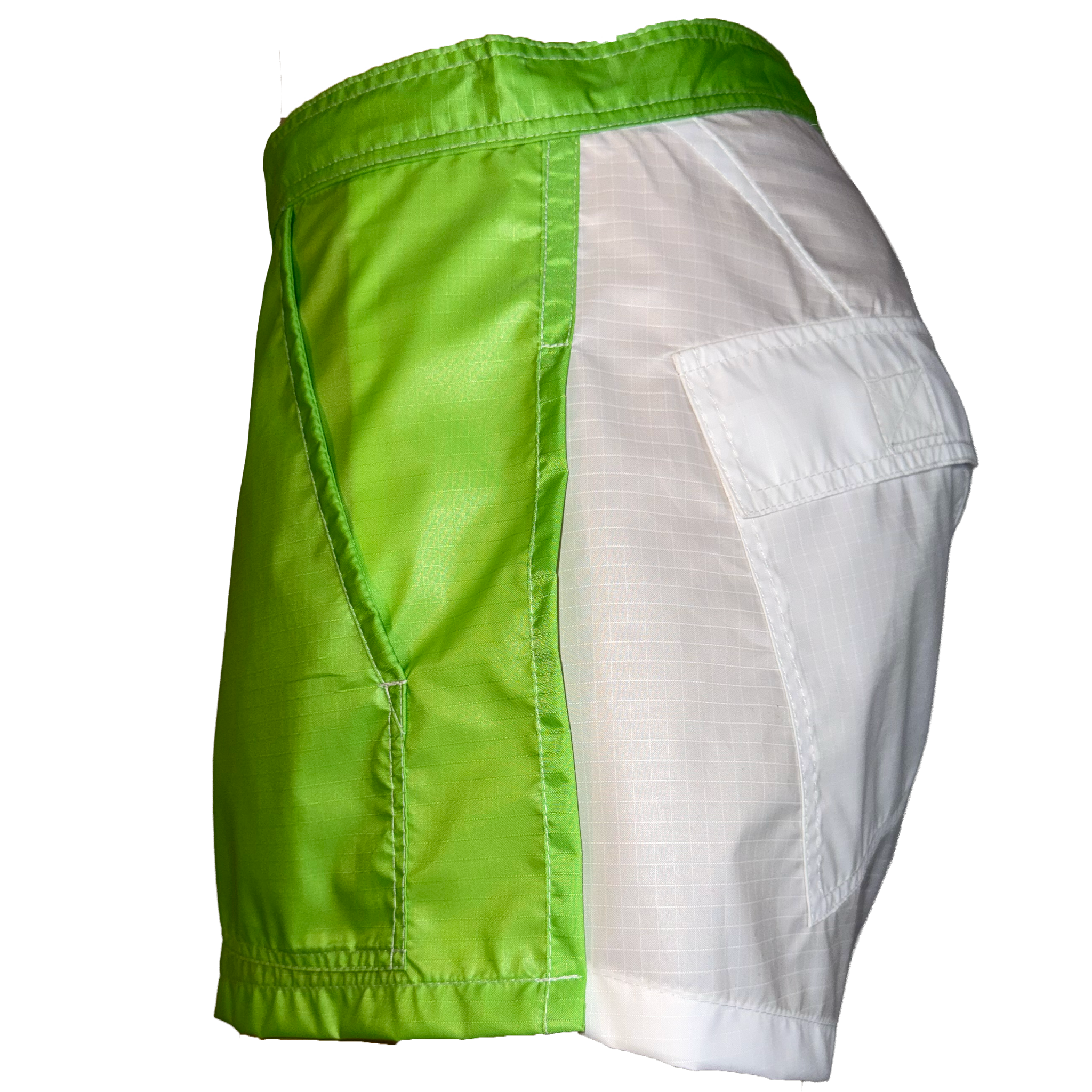 A pair of athletic shorts shown from the side, featuring a bright lime green satin-like left panel and a white textured right panel with a side cargo pocket.