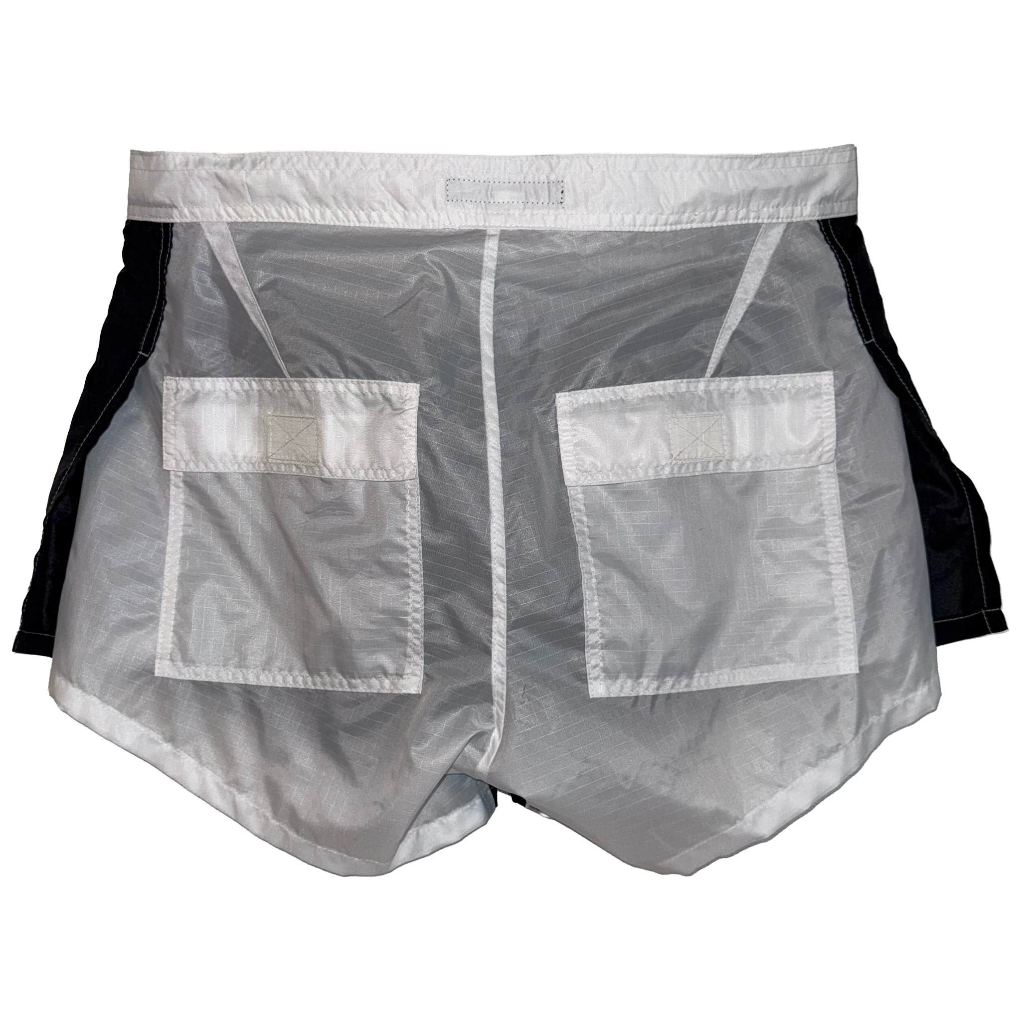 A pair of athletic shorts with a sheer, semi-transparent white front panel featuring two large front pockets, with black side panels and a white waistband, shown against a plain white background.