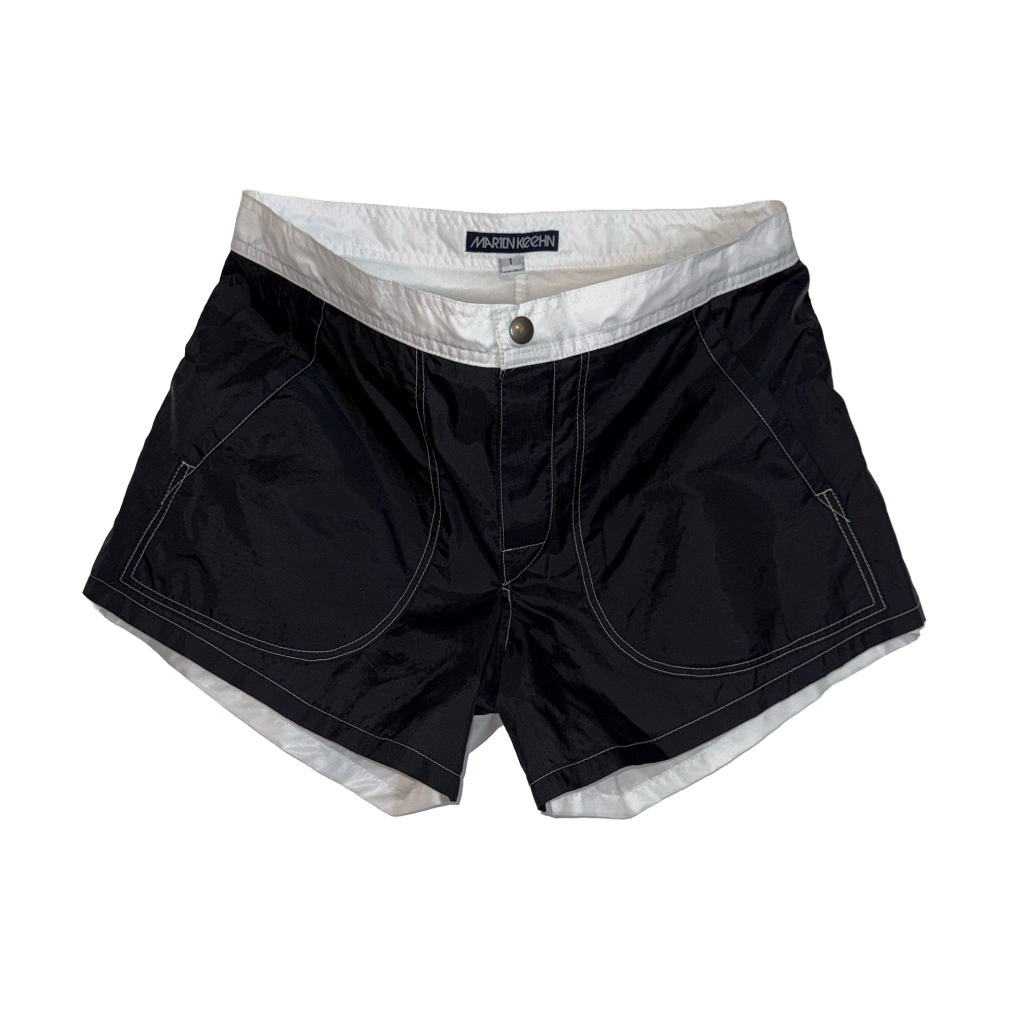 Black swim trunks with a white inner lining and white contrast stitching, featuring a button closure