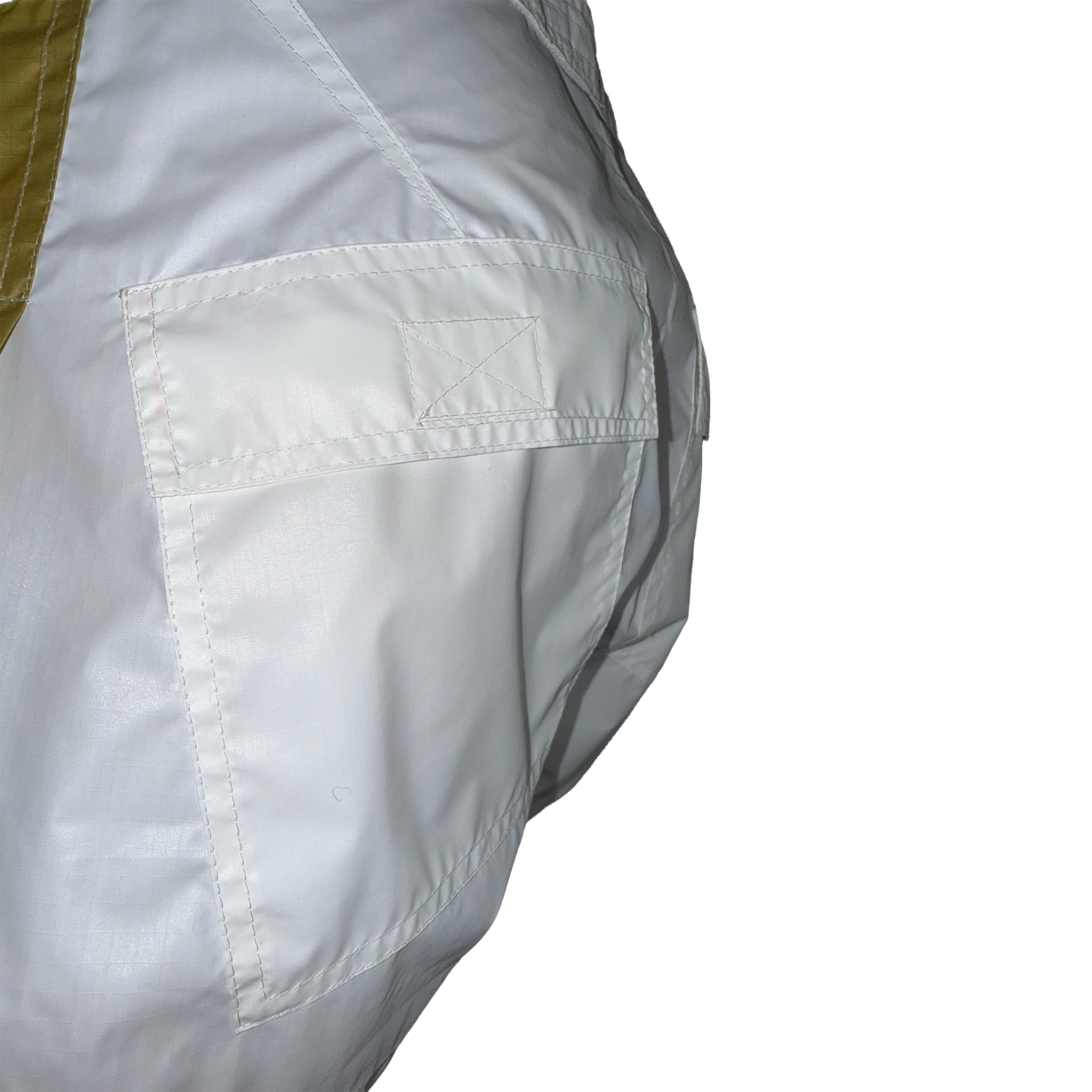 Close-up of a white garment or fabric panel with a stitched pocket and a small olive-green section visible at the upper left, shown against a plain white background.