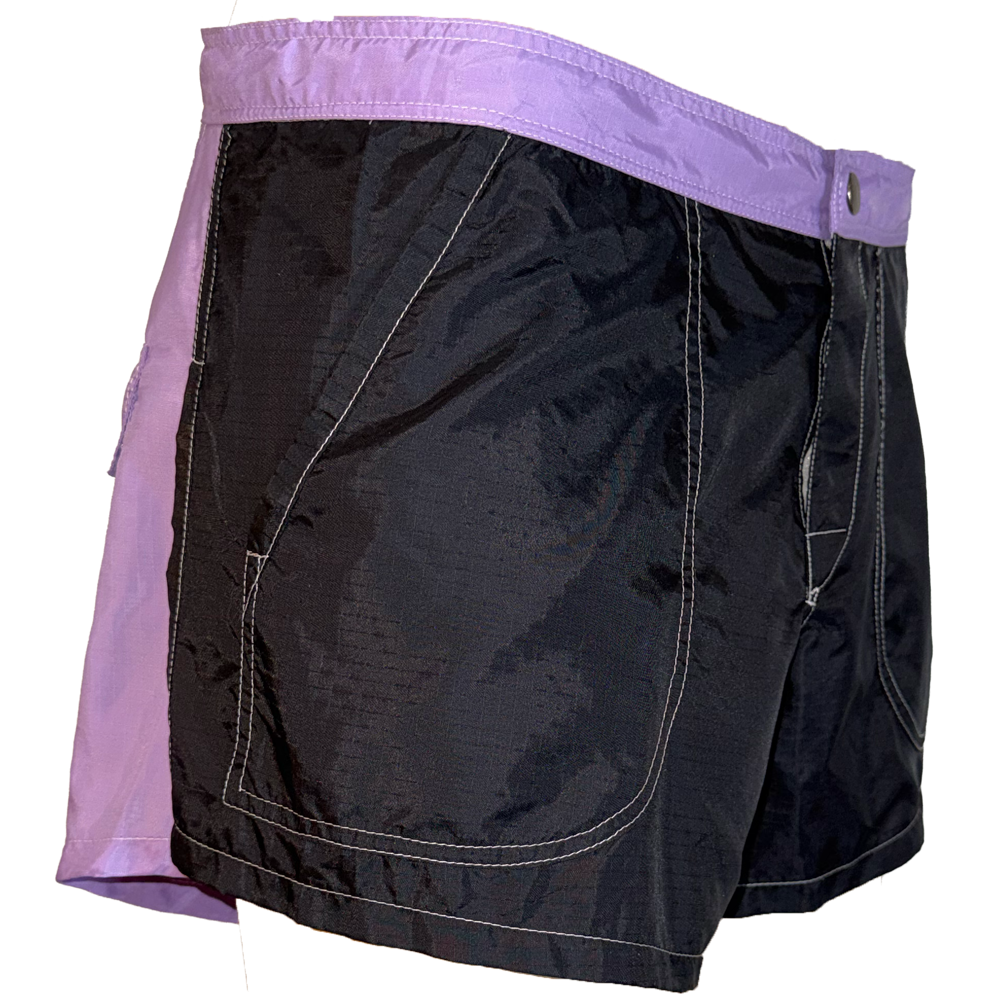 Black and purple athletic shorts with contrast stitching, featuring a wide purple waistband and side pockets, shown against a plain white background.