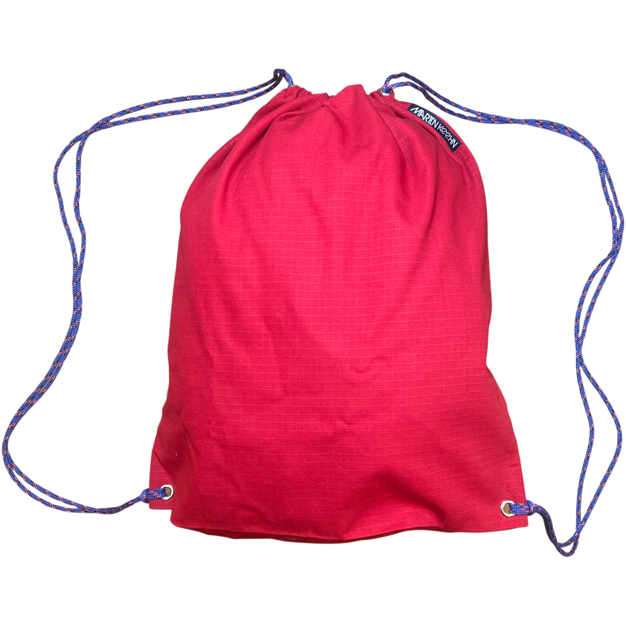 Red drawstring bag with blue strings on a white background.