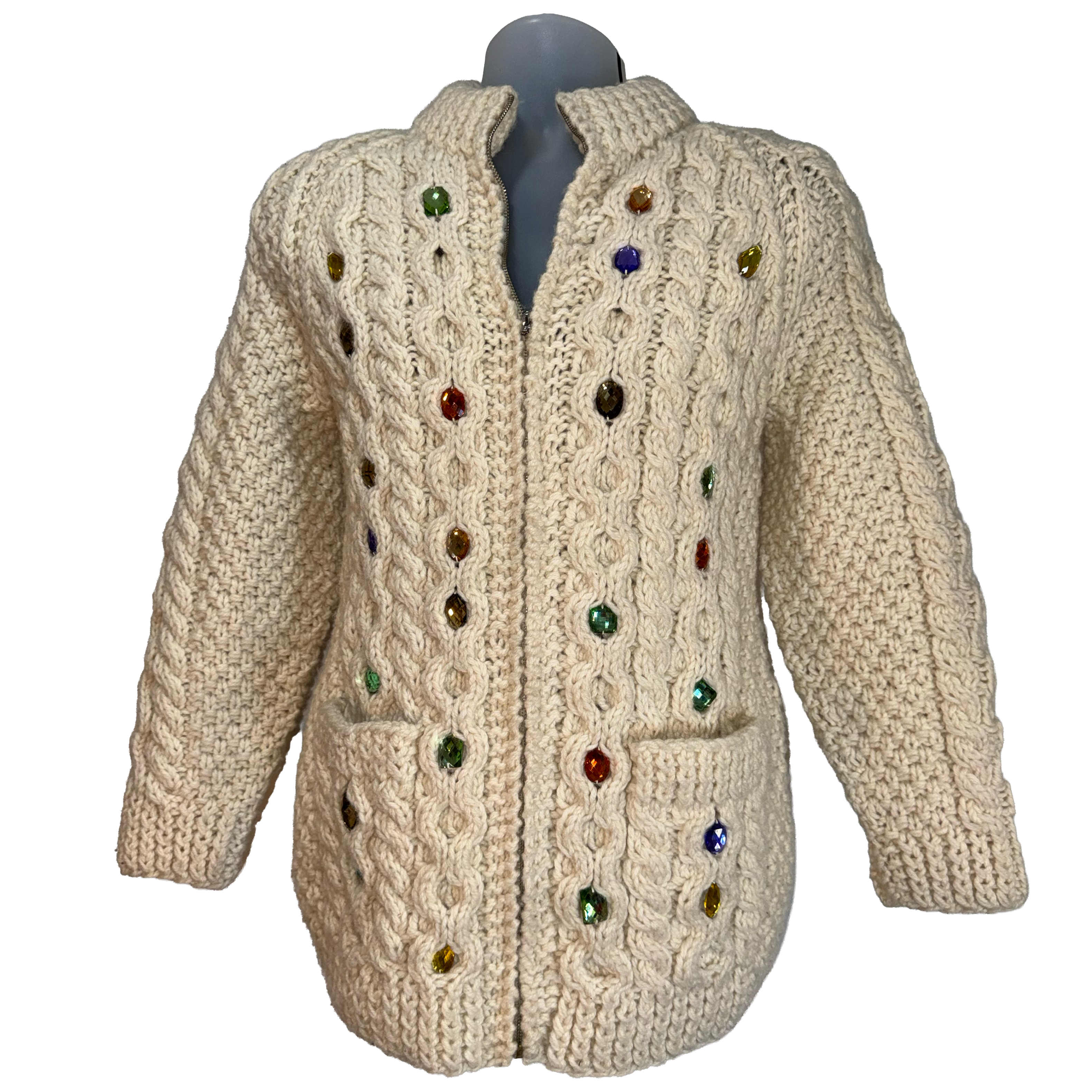 Cream cable-knit cardigan sweater with multicolored rhinestone embellishments, shown on a gray mannequin torso against a white background.