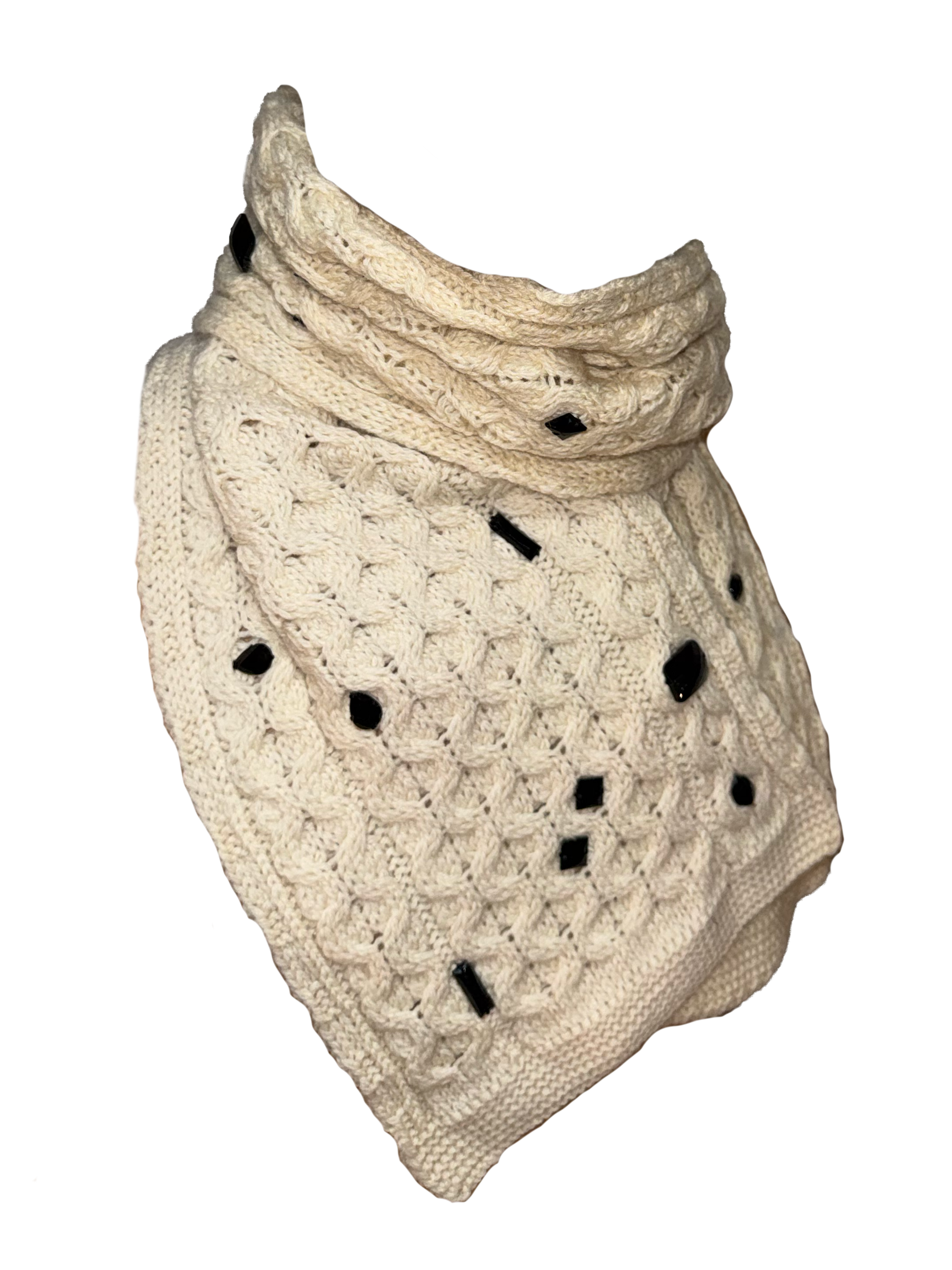 An off-white chunky knit cowl neck warmer with black yarn accents and openwork details, shown against a plain white background.