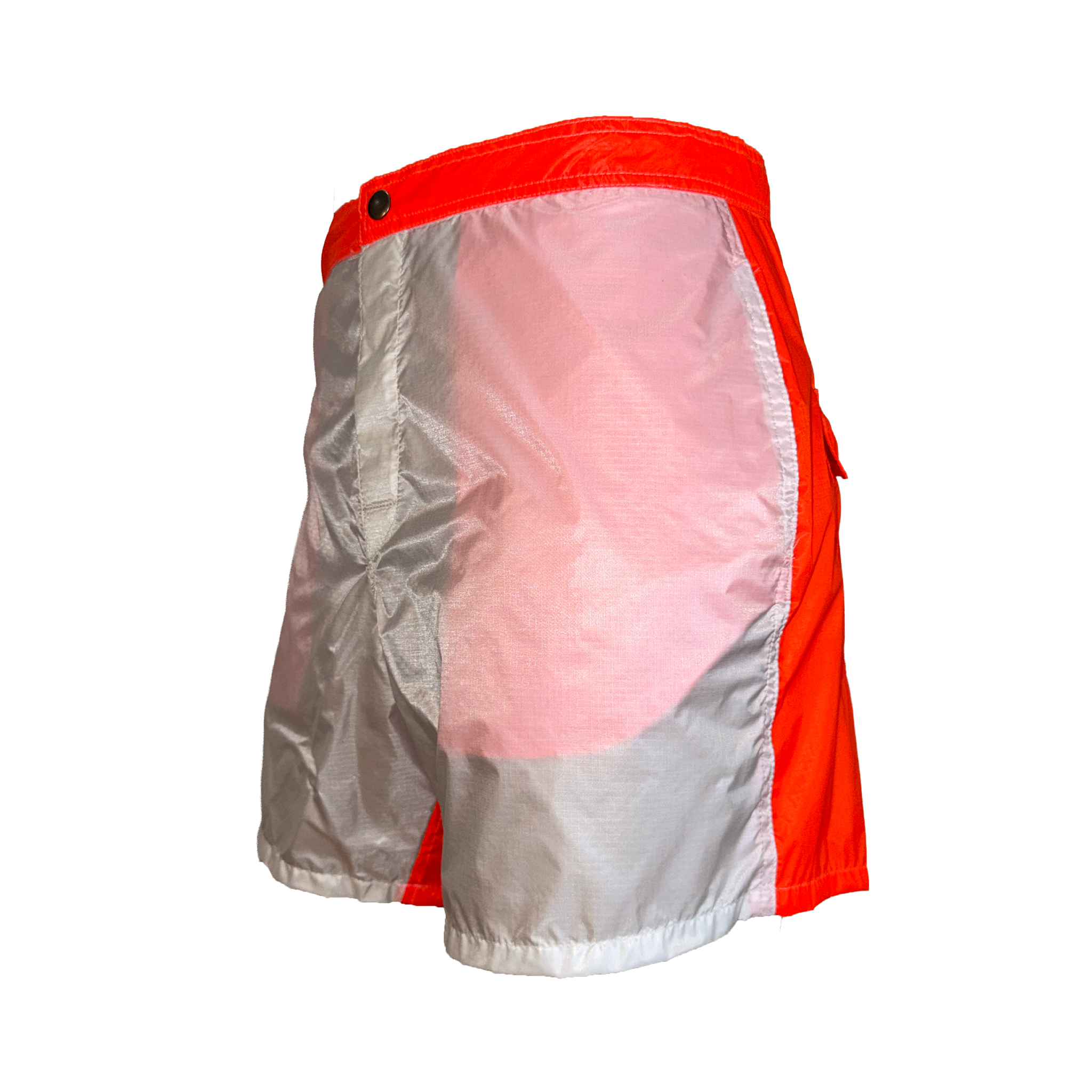 A pair of athletic shorts with a reflective silver back panel and bright orange-red side panels and waistband, shown from a three-quarters back view on a white background.