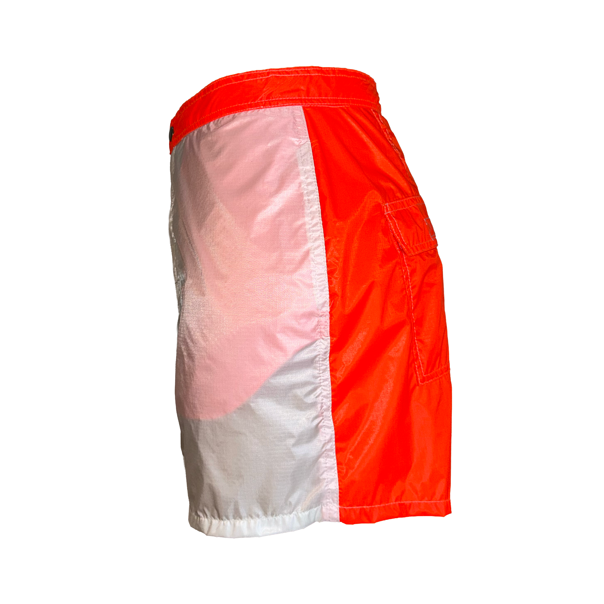 Colorblock swim trunks in a vibrant red, light pink, and white colorway, shown from a three-quarters back view on a solid white background.