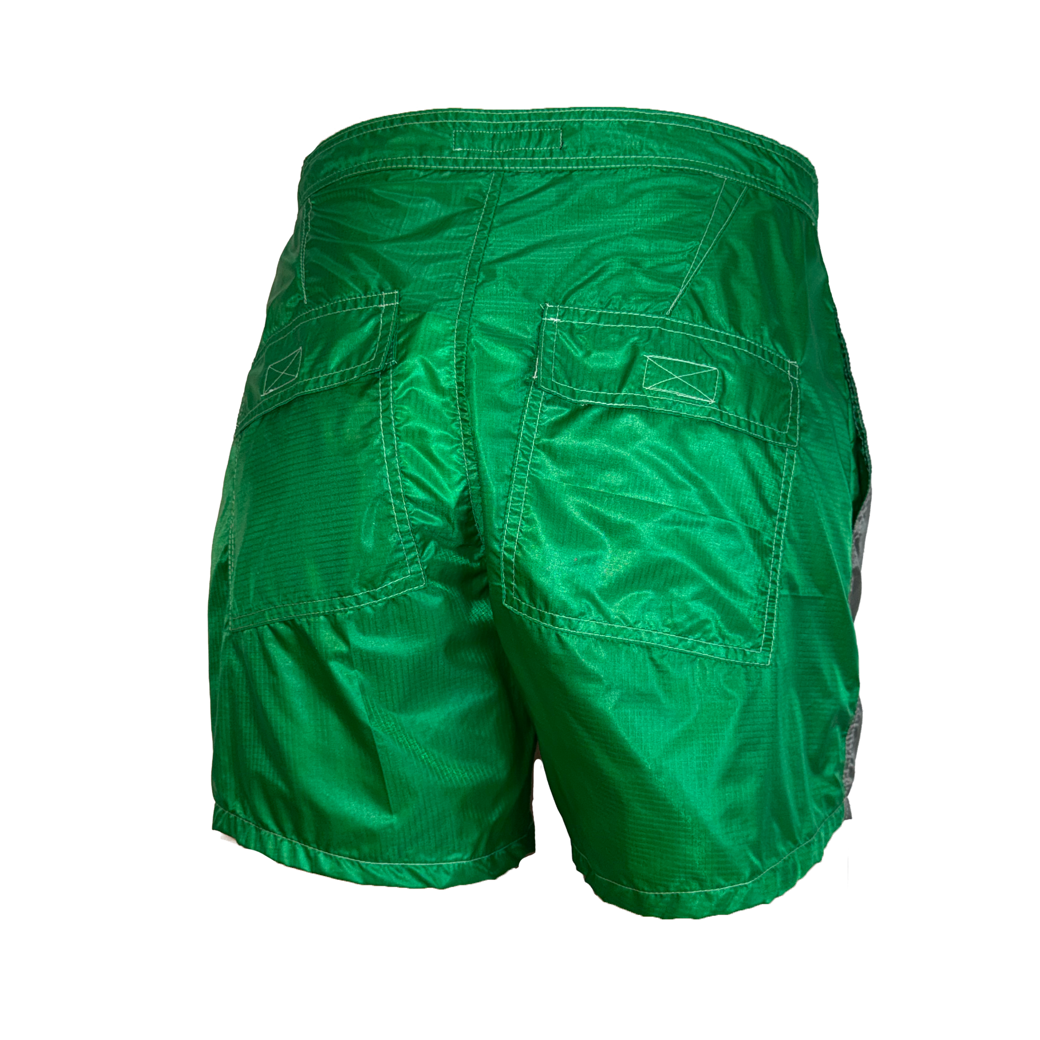 Green athletic shorts shown from the back, featuring two large patch pockets and a textured fabric, isolated on a white background.